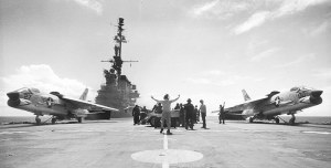 Photo of two F-8 jet fighters about to launch from an aircraft carrier