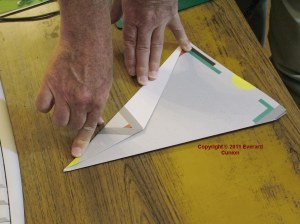 Photo of paper glider under construction
