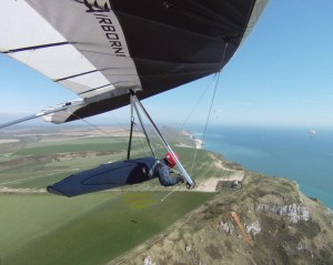Wing-mounted camera photo of Everard Cunion flying a hang glider