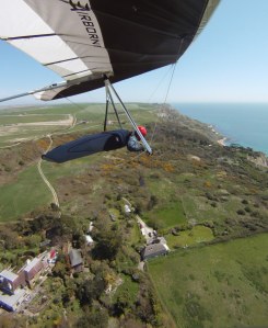 Wing-mounted camera photo of Everard Cunion flying a hang glider
